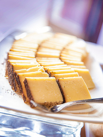 Pieces of Spanish Manchego cheese arranged on a serving platter at Stein Ericksen Lodge.