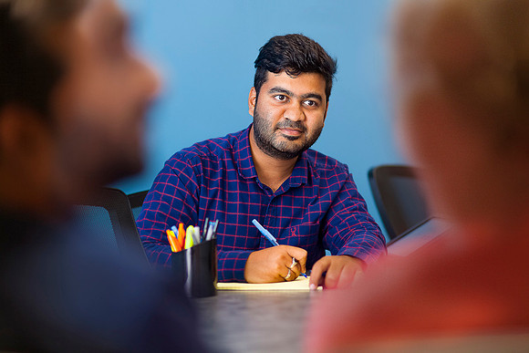 three-office-employees-conference-table.jpg