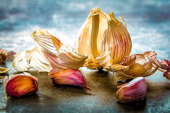 Skin from a garlic bulb and three cloves.