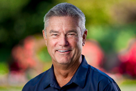 Portrait of an executive man in 60's in a park.