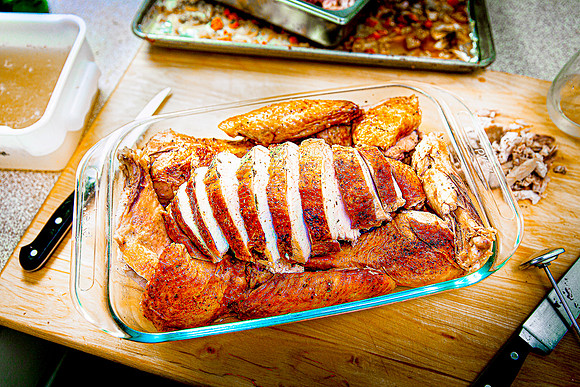 Half of roasted turkey, carved and ready for serving.
