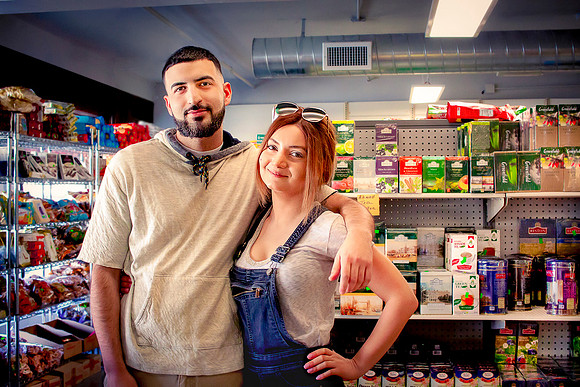 Cute couple who owns East European grocery store.
