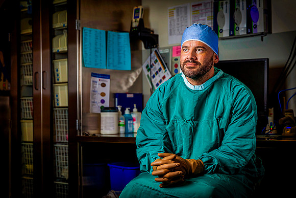 Anesthesiologist in operating room before surgery.