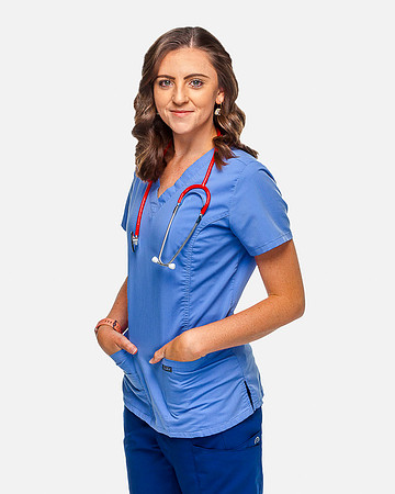An attractive female nurse on a white background.